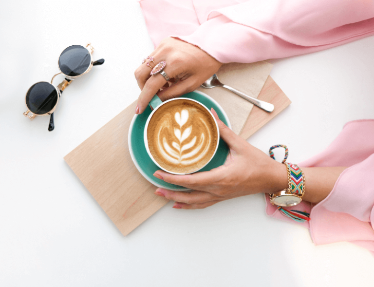 Photo of hands holding coffee mug