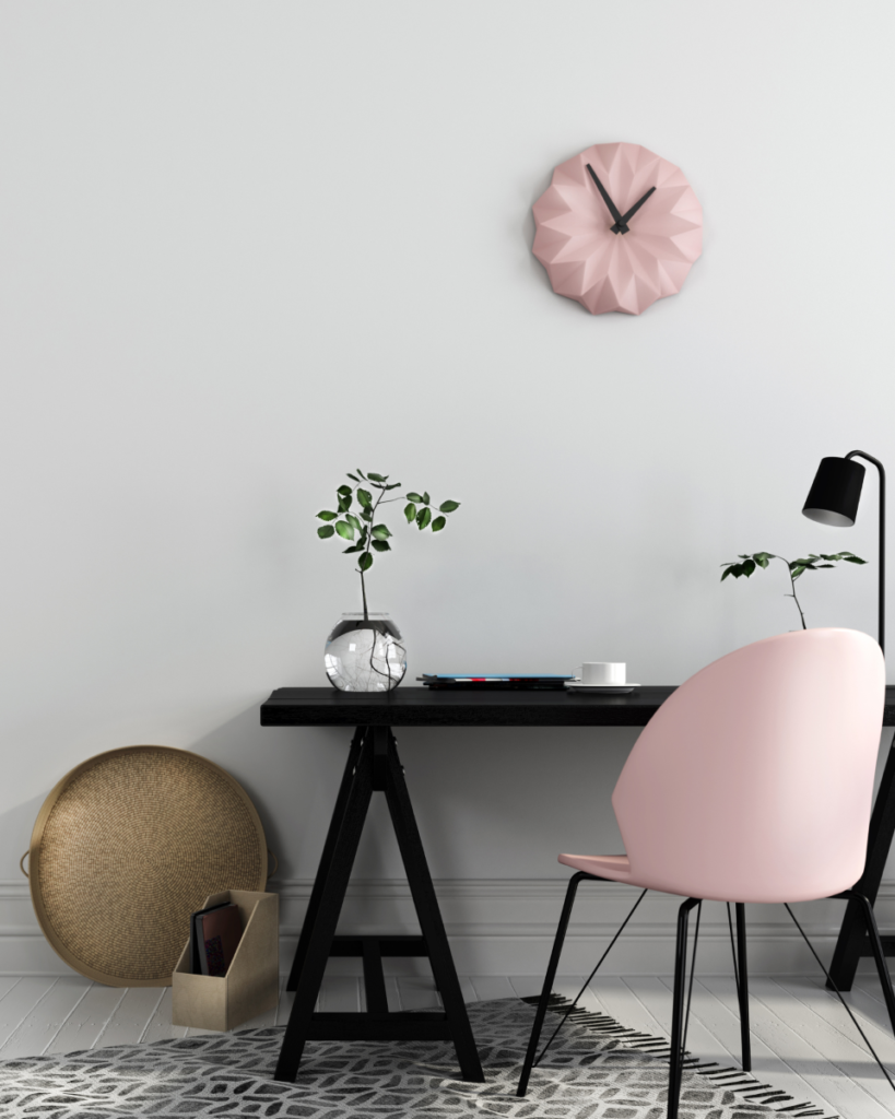 Image of office desk with pink chair and clock